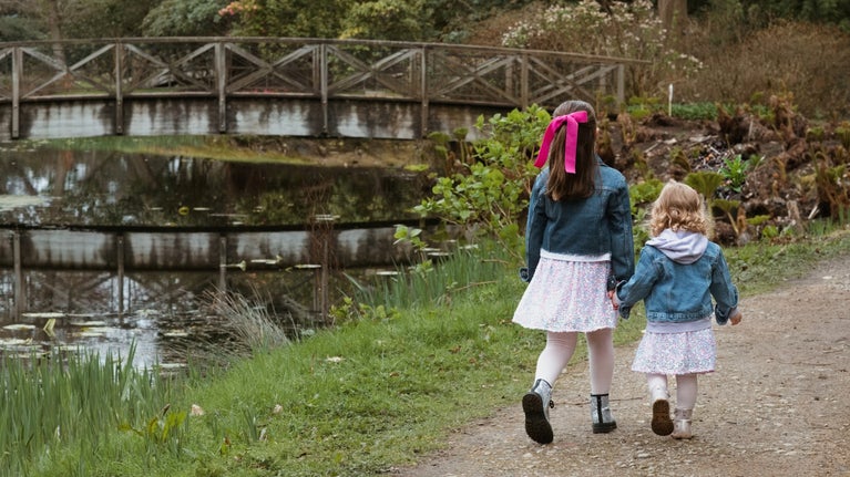 Children visiting the gardens in summer at Tatton Park, Cheshire.